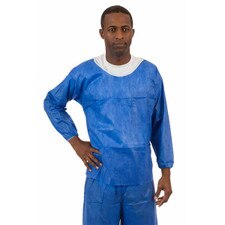 Model wearing International Enviroguard Soft Scrubs SMS long-sleeve scrub top in denim blue with elastic wrists and chest pocket