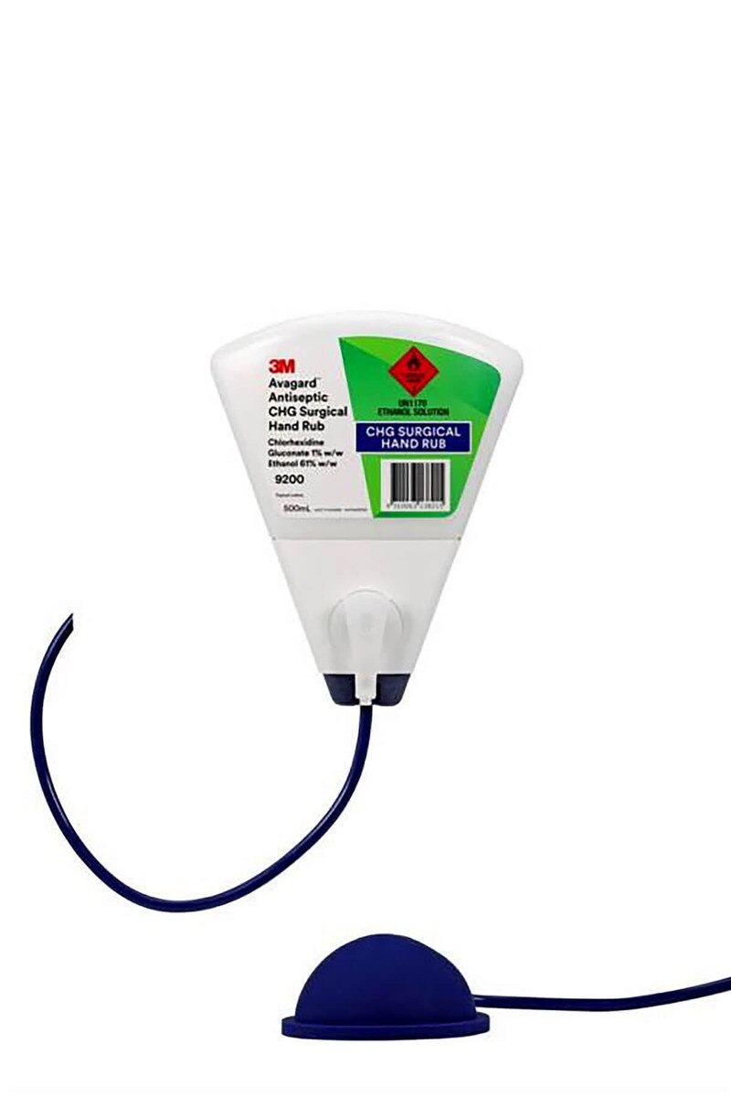 3M Avagard antiseptic CHG surgical hand rub dispenser mounted with wall bracket and connected foot pump pedal via flexible tubing.