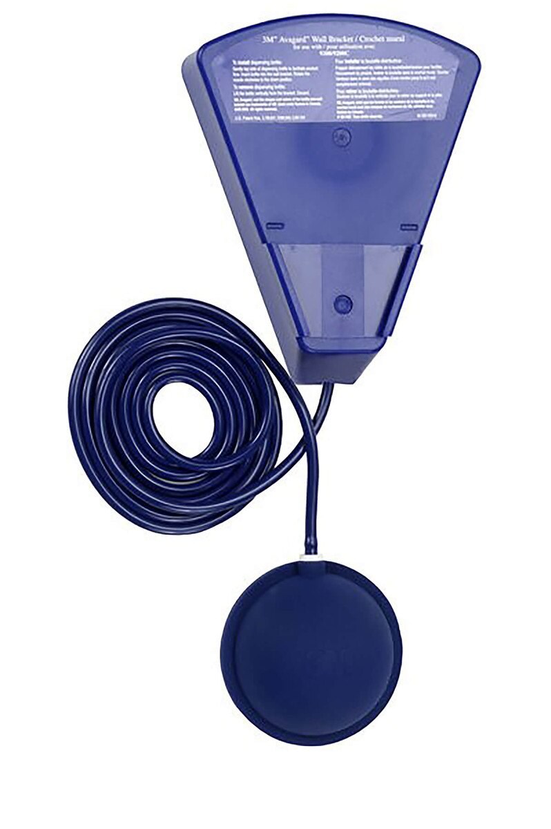 Rear view of Avagard wall-mounted dispenser showing coiled tubing attached to round foot pump pedal for hands-free operation.
