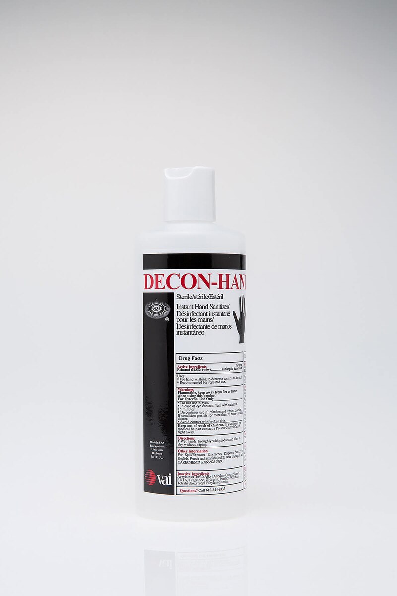 Front view of DECON-HAND ethanol-based instant hand sanitizer bottle with flip-top cap and full product label.