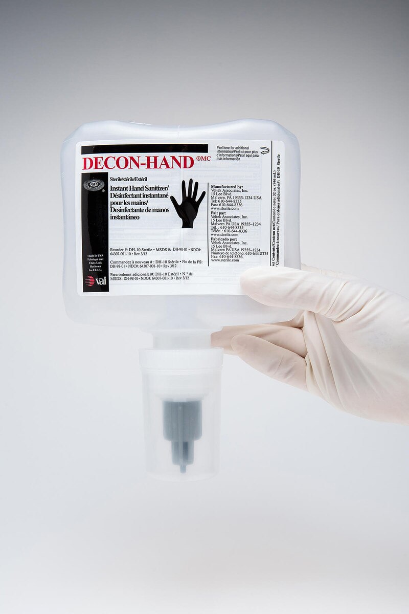 Close-up of DECON-HAND ASEPTI-CLEANSE 32oz refill pouch with label and bottom dispensing valve visible.
