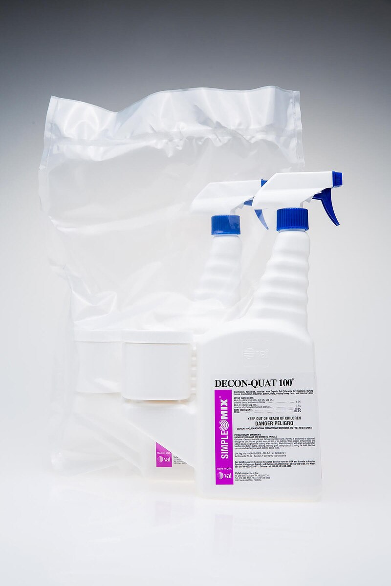 Side-by-side display showing one sterile-bagged Decon-Quat 100, 16oz SimpleMix trigger spray bottle placed behind an unwrapped sterile bottle, both upright.