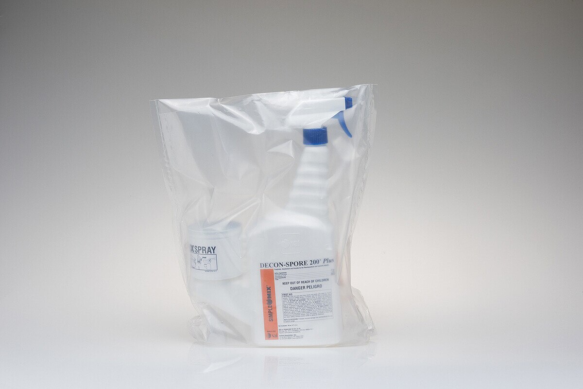 Bagged DECON-SPORE 200 Plus 3% trigger spray bottle with attached SimpleMix reservoir inside sterile packaging