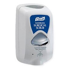 Purell TFX touch-free wall-mounted dispenser for waterless surgical scrub, featuring a white housing with blue Purell label and automatic sensor dispensing area.