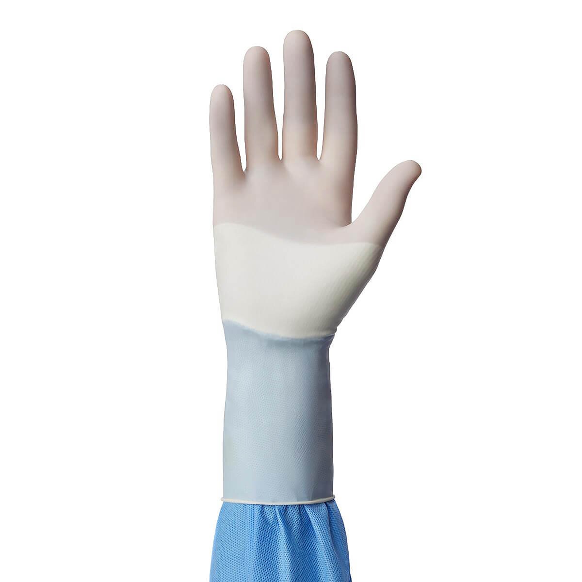 White Medline SensiCare PI with Aloe surgical glove worn over a blue gown cuff, size 7.5
