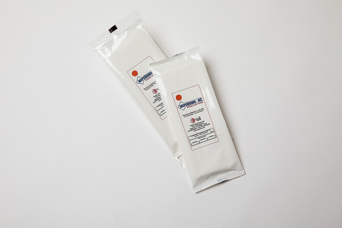 Two sealed packs of WipeDown HC sterile dry wipes displayed side-by-side on a clean white surface