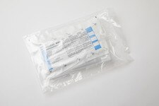 Sterile DECON-CLEAN pre-saturated residue remover wipes in sealed poly packaging, showing product labeling and double-bag sterile outer wrap.